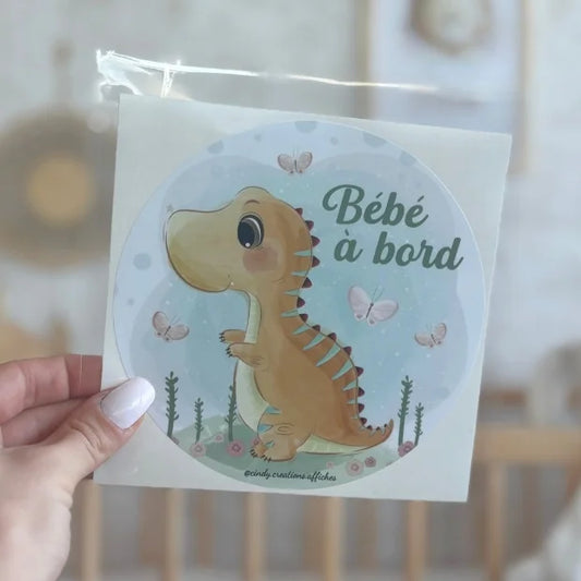 stickers bebe a bord dinosaure illustration en main